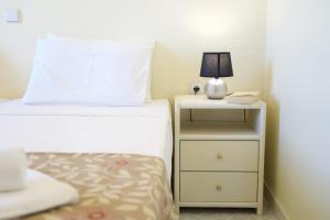 A bed or beds in a room at The Sunset Villa Kefalonia