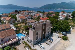 an aerial view of a residential neighbourhood with a house and a pool at Moderna Luxury Apartments with HEATED pool in Tivat