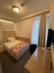Letto o letti in una camera di Old Town Hotel
