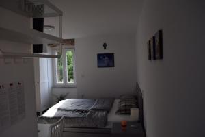 Postel nebo postele na pokoji v ubytování APARTMENTS SCIRENICA