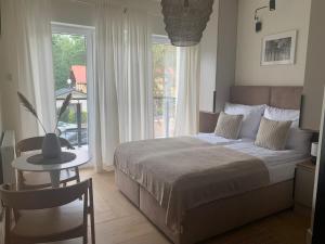 Łóżko lub łóżka w pokoju w obiekcie Na Wczasowej - Apartamenty
