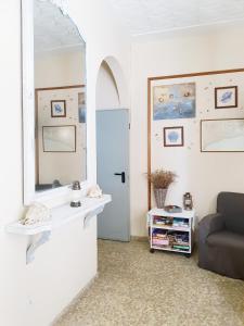 a living room with a couch and a mirror at Hotel Maeva ,1 star B&B in Lloret de Mar