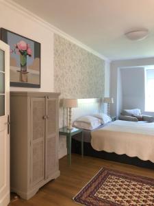 Posteľ alebo postele v izbe v ubytovaní Galerie Suites