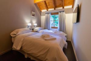 Postel nebo postele na pokoji v ubytování Apart Hotel Agua Escondida