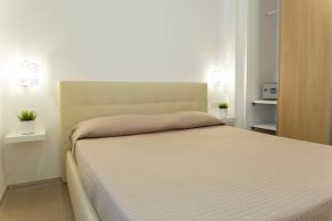 Postel nebo postele na pokoji v ubytování B&B Di Risio