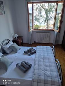 a bedroom with two beds with towels on them at Dal Mariano in Brenzone sul Garda