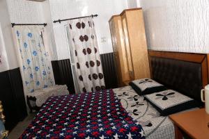 Katil atau katil-katil dalam bilik di Hotel Tip Top