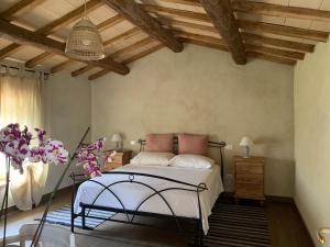 Postel nebo postele na pokoji v ubytování Tenuta Gambit Agriturismo Umbria