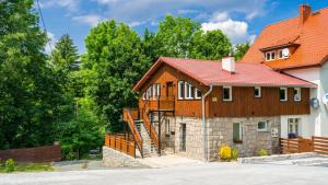 a house with a red roof at Stacja Sniezka in Karpacz