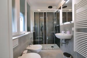 a bathroom with a shower and a toilet and a sink at Amar in Levanto