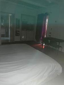 Postel nebo postele na pokoji v ubytování L'hôtel du Bastier
