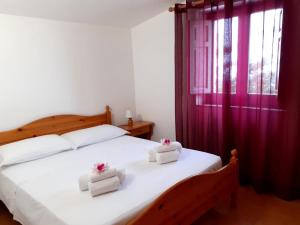 Letto o letti in una camera di LEO APPARTAMENTI con vista panoramica