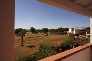 a view of a yard from a house at Sea View Vista Mare - Soggiorni settimanali da sabato a sabato in Isola Capo Rizzuto
