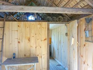 an inside view of a wooden cabin with wooden walls at 4 person holiday home in N SSJ in Nässjö