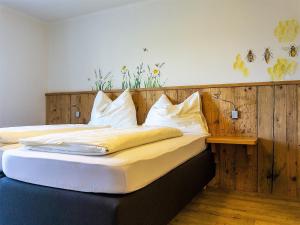 Cama o camas de una habitación en Alpengasthof Hochsöll