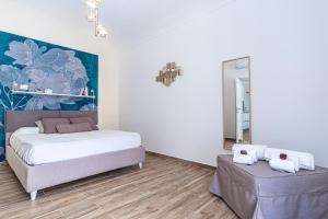 Posteľ alebo postele v izbe v ubytovaní FLOWER SUITE B&B