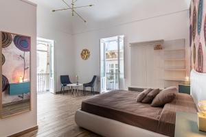Posteľ alebo postele v izbe v ubytovaní FLOWER SUITE B&B