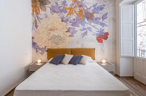Posteľ alebo postele v izbe v ubytovaní FLOWER SUITE B&B