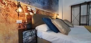 Postel nebo postele na pokoji v ubytování Le Sciantose Relais