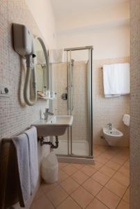 a bathroom with a shower and a sink at Hotel Belvedere in Porto SantʼElpidio