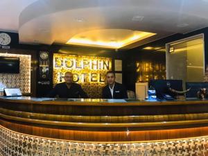 two men sitting at a bar in a restaurant at Dolphin Ras El-Bar Hotel in Ras El Bar +73 photos