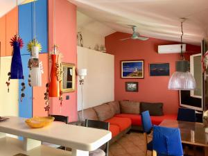 a living room with a couch and a table at Casa SERGIO Budva Rooms & Apartments in Budva