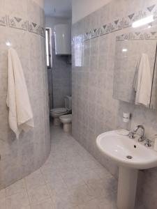 Ванна кімната в Casa Vacanze le Palme Netine