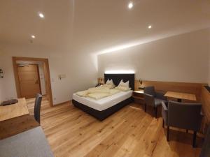 Ένα ή περισσότερα κρεβάτια σε δωμάτιο στο Hotel Mignon