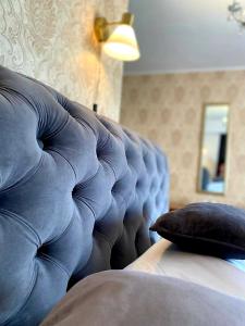 a close up of a couch with a pillow at Casa Topazz in Târgu Jiu