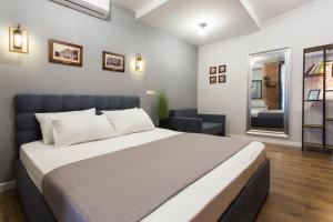 Katil atau katil-katil dalam bilik di Cozy apartment in the Center - Podilskyi lane 7