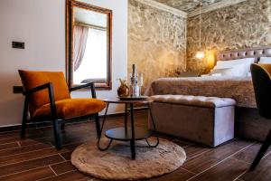 Ein Sitzbereich in der Unterkunft Luxury Rooms VINDEMIÆ