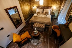 Ein Bett oder Betten in einem Zimmer der Unterkunft Luxury Rooms VINDEMIÆ