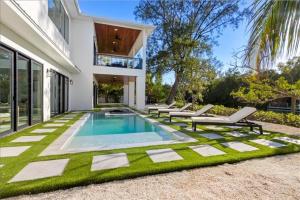 a swimming pool in the backyard of a house at Our Great Escape home in Anna Maria