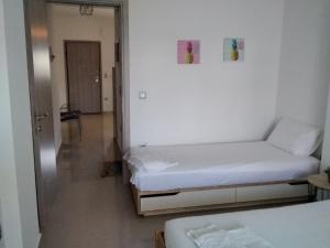Postel nebo postele na pokoji v ubytování Ioannas