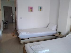 Postel nebo postele na pokoji v ubytování Ioannas
