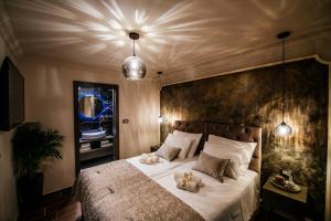Ein Bett oder Betten in einem Zimmer der Unterkunft Luxury Rooms VINDEMIÆ