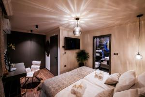 Ein Bett oder Betten in einem Zimmer der Unterkunft Luxury Rooms VINDEMIÆ