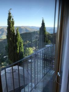 a balcony with a view of a valley at Quinta de Santa Marinha in Castedo