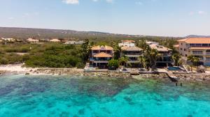 an aerial view of a resort and the ocean at One Ocean Boutique Apartments & Suites Bonaire in Kralendijk