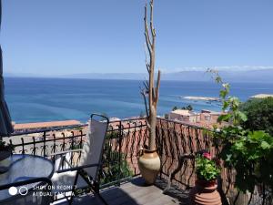 a balcony with a view of the ocean at Violetta Rooms in Koroni