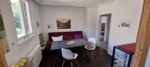 a small living room with a table and a couch at Ferienwohnung U73 in Lauterbach