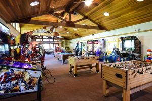 a room with several arcade games and consoles at Indian Hills 6020 in Truckee