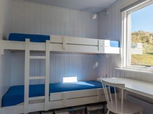 Palanda nebo palandy na pokoji v ubytování Holiday home Fanø C