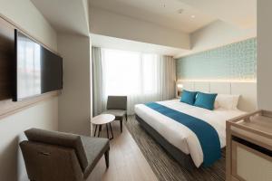 Hewitt Resort Naha房間的床