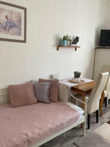 a living room with a couch and a table at Penzion Hrádecký Dvůr in Pilsen