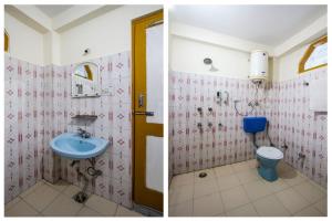 Mountain Dew Guest House في مانالي: حمام مع حوض ومرحاض