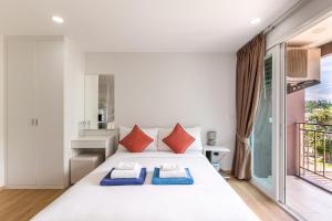 Postel nebo postele na pokoji v ubytování Ozone Condotel by RESAVA