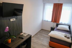 TV a/nebo společenská místnost v ubytování Apartments A7