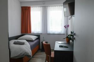 Postel nebo postele na pokoji v ubytování Apartments A7