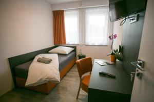 Postel nebo postele na pokoji v ubytování Apartments A7